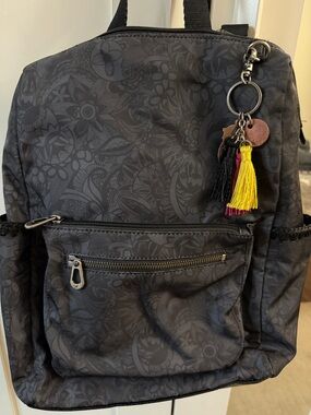Sakroots Black Floral Print Backpack with Yellow & Pink Tassel Charm